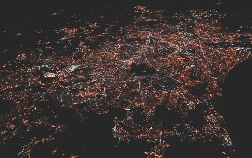 electronical network - city lit up at night as visualization of waste attack surface